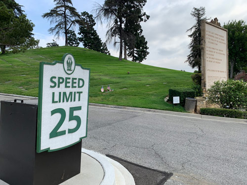 [Photograph of a sign announcing a speed limit
of twenty-five miles per hour at Forest Lawn, Glendale.]