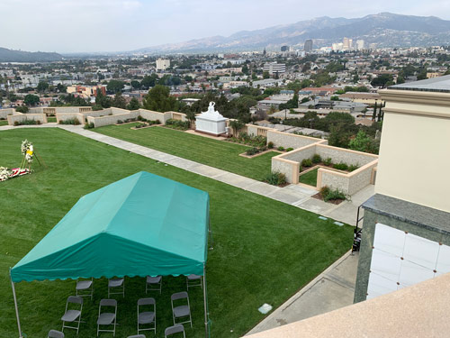 [Photograph of preparations for a funeral in a
terrace of new graves at Forest Lawn, Glendale.]