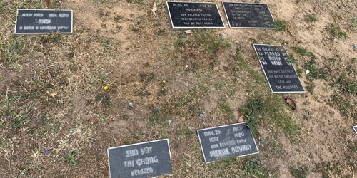 [Photograph of a patchy lawn with small
rectangular stones cut with inscriptions like "Sun Yat, Tai Chong, beloved";
"Snoopy, our beloved friend, temporarily parted, till we meet again," October
26, 1966-January 22, 1980; "Simi, a dear & lovable kitty," July 1975-December
1979; "Marri-O, Penrod, Misty, Heidi, our precious pets, gone but not
forgotten"; "Our precious Boston Terriers 1980-1992 Ch. Candy Kisses, Ch. Toni
Sue, Ch. Holly, Jodie, Kiki, Joy, Jet Pilot"]