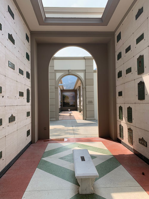 [Walls covered with grave
markers in an open-air mausoleum.]