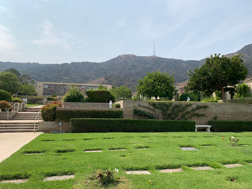 [View of stairs up through
terraced lawns toward the same large building, with the Mount Lee radio mast in
the background.]