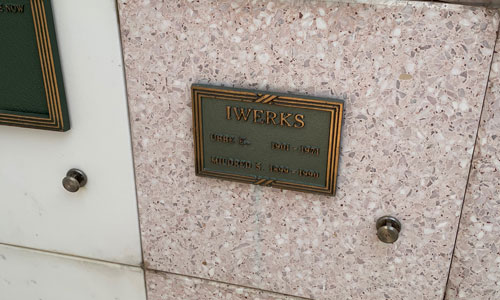[Small metal plaque with the
name "Iwerks" mounted on a square terrazzo panel.]