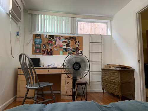 [Photograph of my old bedroom, seen from the bed.]