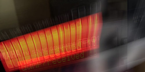 [Long-exposure photograph of a Yamaha FB-01
synthesizer with a ghostly image of Erik Satie.]