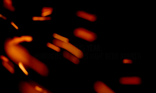 [Glowing embers against a
dark background.]