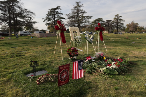 [Walls covered with grave
markers in an open-air mausoleum.]