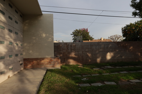[View of stairs up through
terraced lawns toward the same large building, with the Mount Lee radio mast in
the background.]